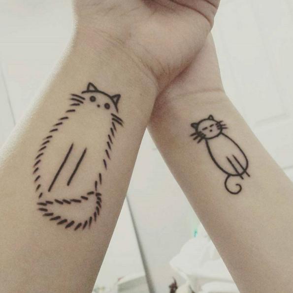 two cats sister tattoo